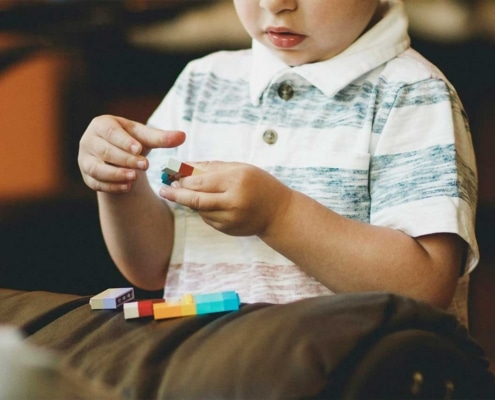 Child playing with legos