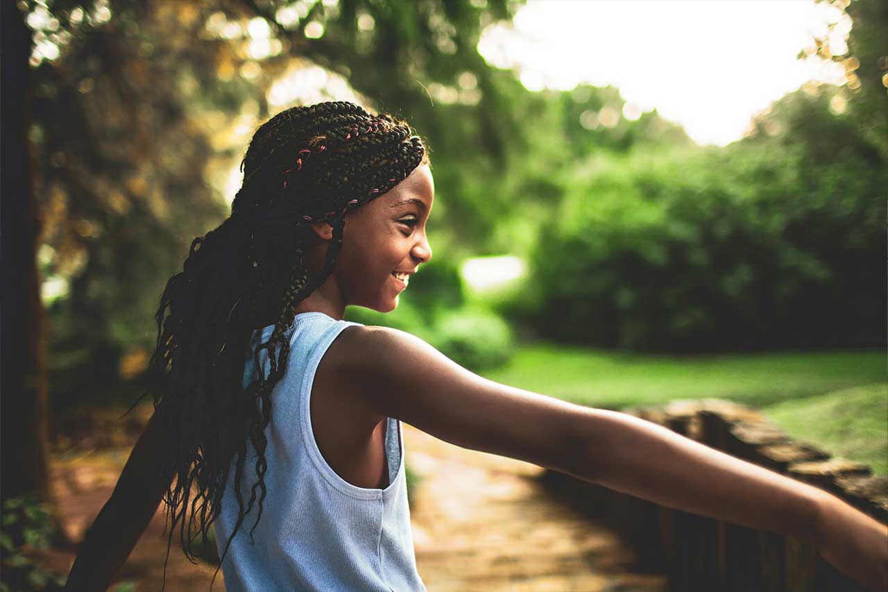 girl smiles in nature